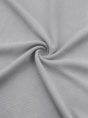 Light gray textured waffle knit fabric detail of joggers