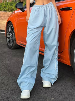 Light blue wide-leg maternity pants with gathered waistband and white side stripe detail.