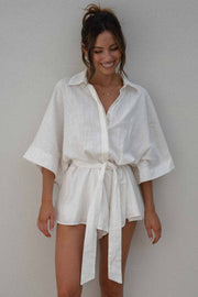 White linen kimono sleeve romper with tie waist and collar