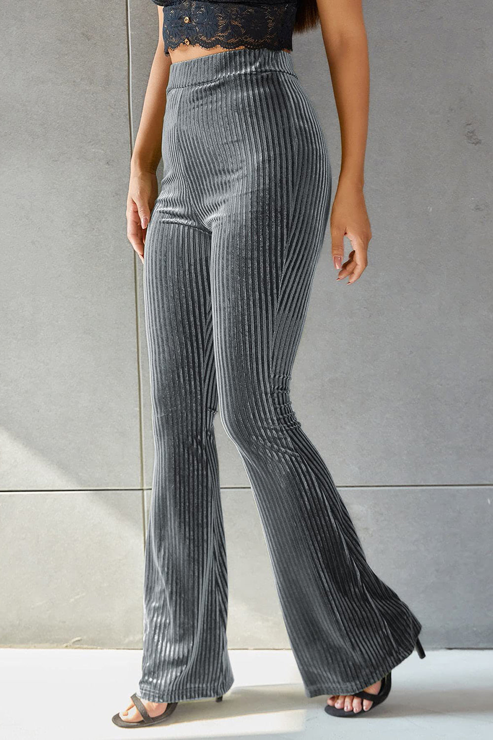 Ribbed velvet palazzo trousers in dark gray with a high waist and flared leg.