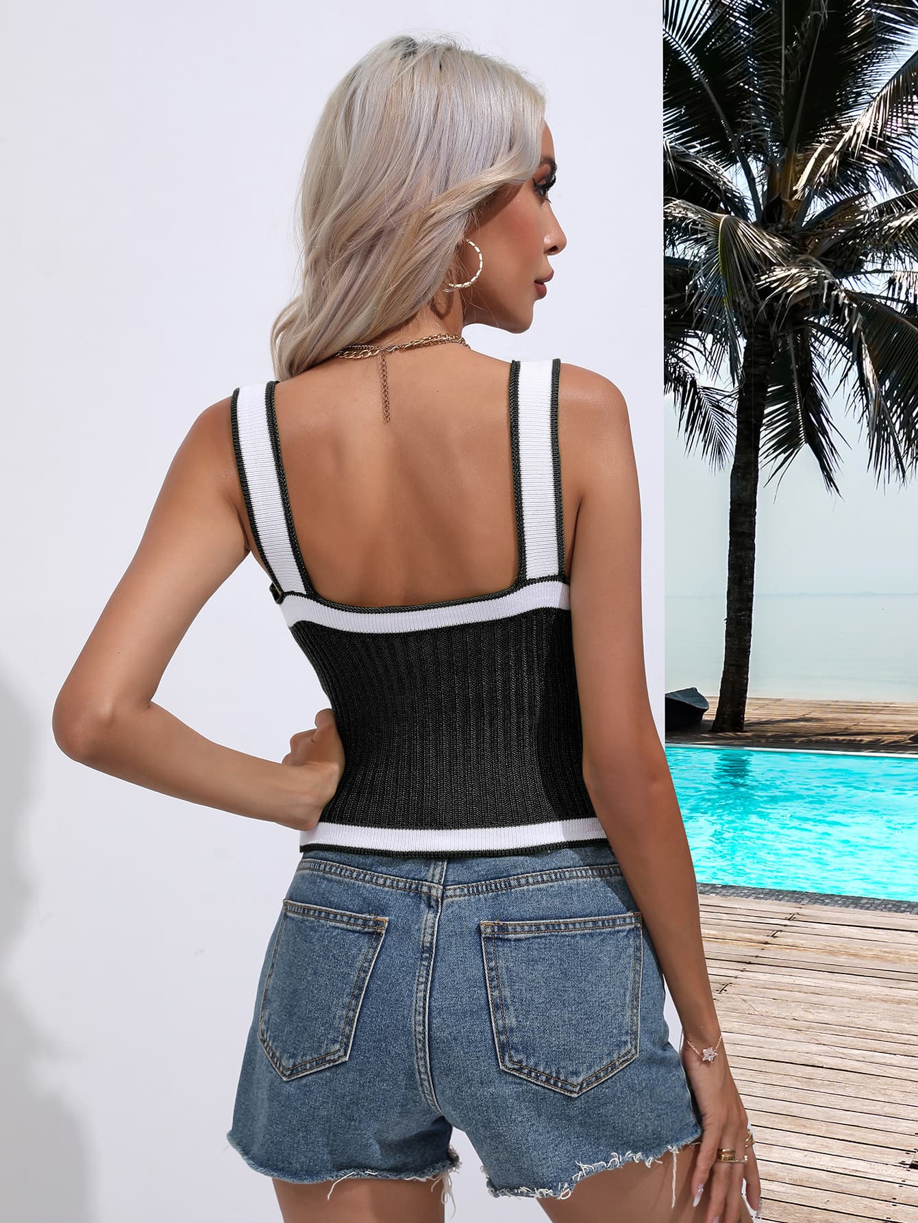 Black knit tank top with white contrast trim and square neckline.