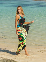 Owl graphic pareo wrap with black, yellow, and multicolor floral pattern.