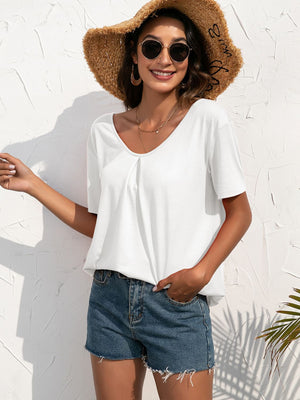 White t-shirt with V-neck and short sleeves, featuring subtle front pleats.
