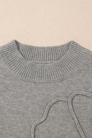 Gray knit top with a ribbed crewneck and drawstring detail.