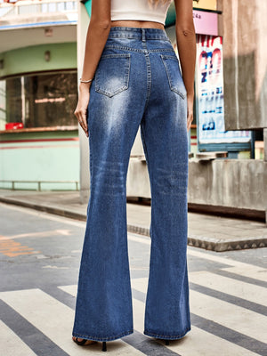 Dark blue denim flare jeans with faded details and a buttoned waist.
