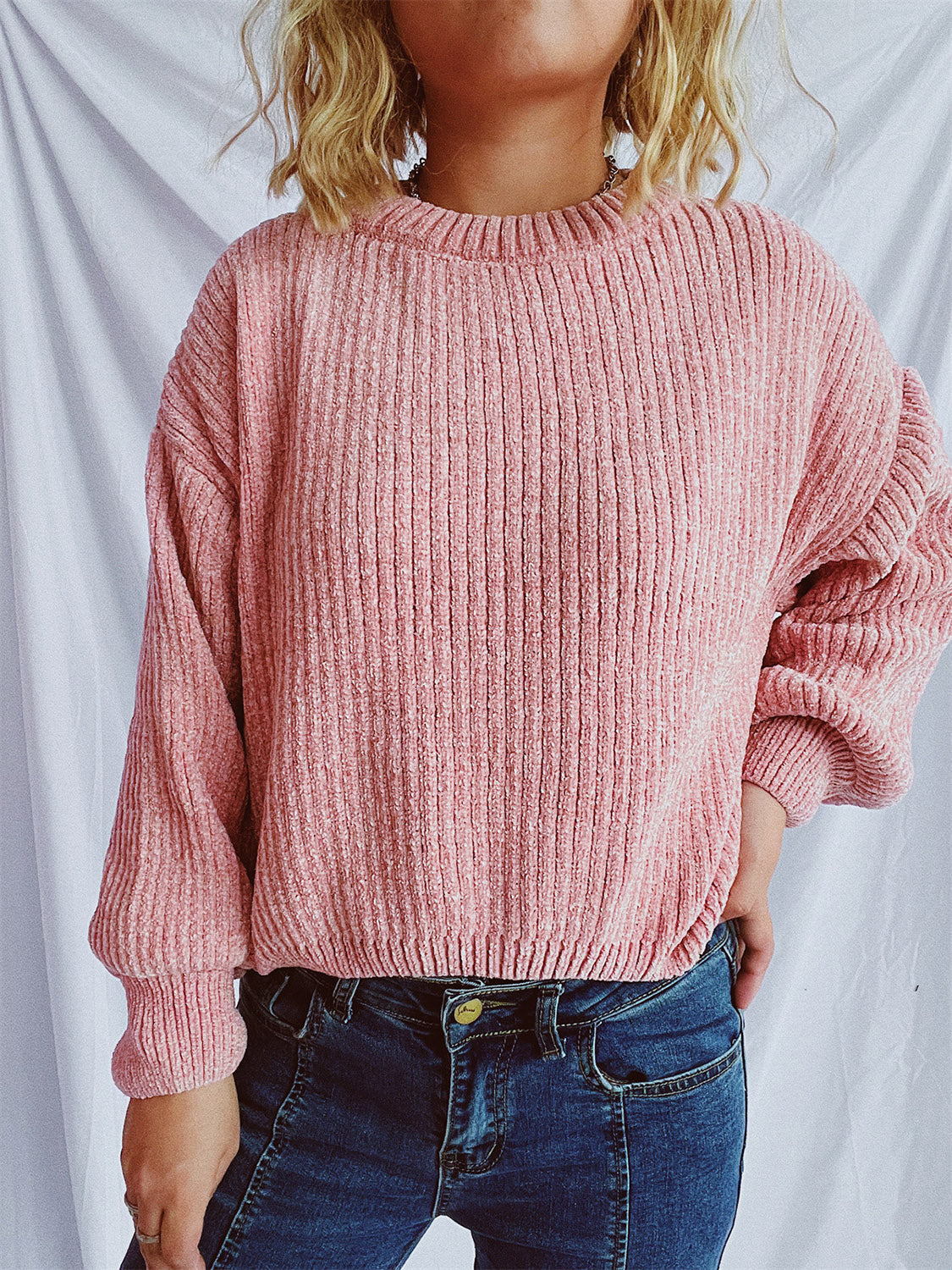 Relaxed crewneck pullover sweater in Dusty Pink with textured ribbing and balloon sleeves.