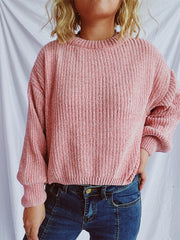Relaxed crewneck pullover sweater in Dusty Pink with textured ribbing and balloon sleeves.