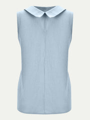 Light blue sleeveless Peter Pan collar blouse with textured fabric.