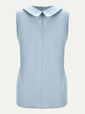 Light blue sleeveless Peter Pan collar blouse with textured fabric.