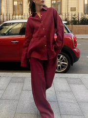 Burgundy relaxed fit button-up shirt and wide-leg pants set.