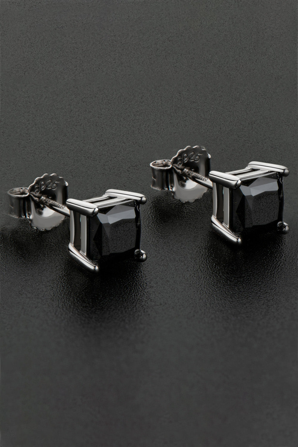 Black square moissanite stud earrings with silver settings.