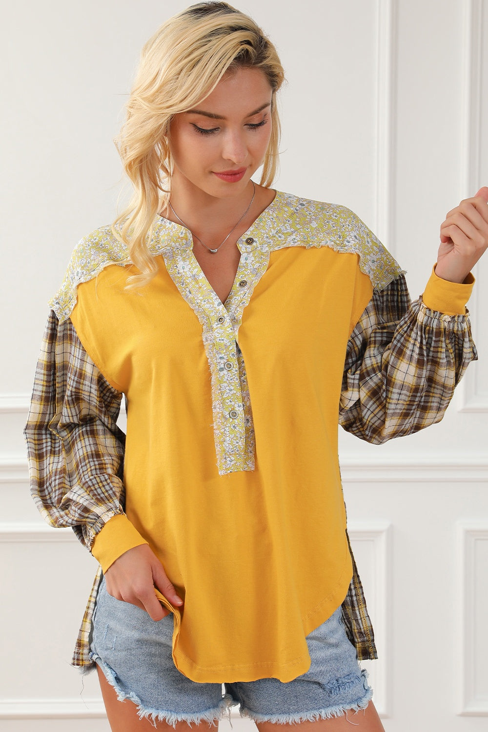 Yellow mixed media plaid yoke blouse with floral trim and button front.