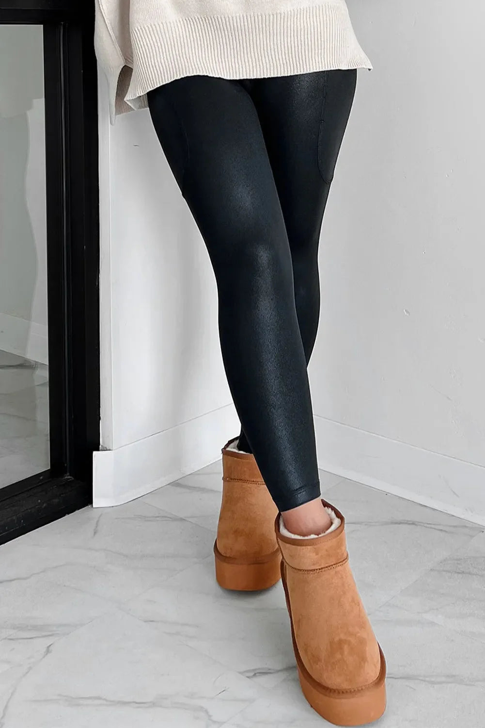 Black textured faux leather leggings with pocket detail