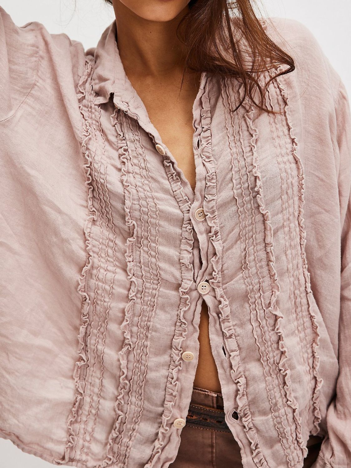 Dusty Pink linen button-down blouse with vertical ruffles and button front.
