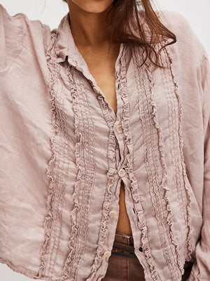 Dusty Pink linen button-down blouse with vertical ruffles and button front.