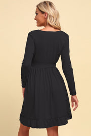 Black long sleeve wrap dress with ruffled hem and tie waist