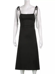 Black ruched midi dress with square neckline and tie straps