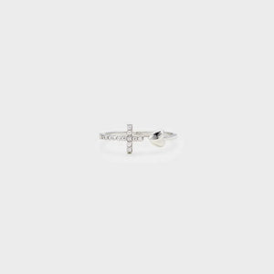 Silver ring with open heart and diamond-accented cross detail