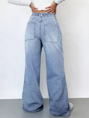 Light wash denim wide-leg cargo jeans with elastic waistband and large back pockets.