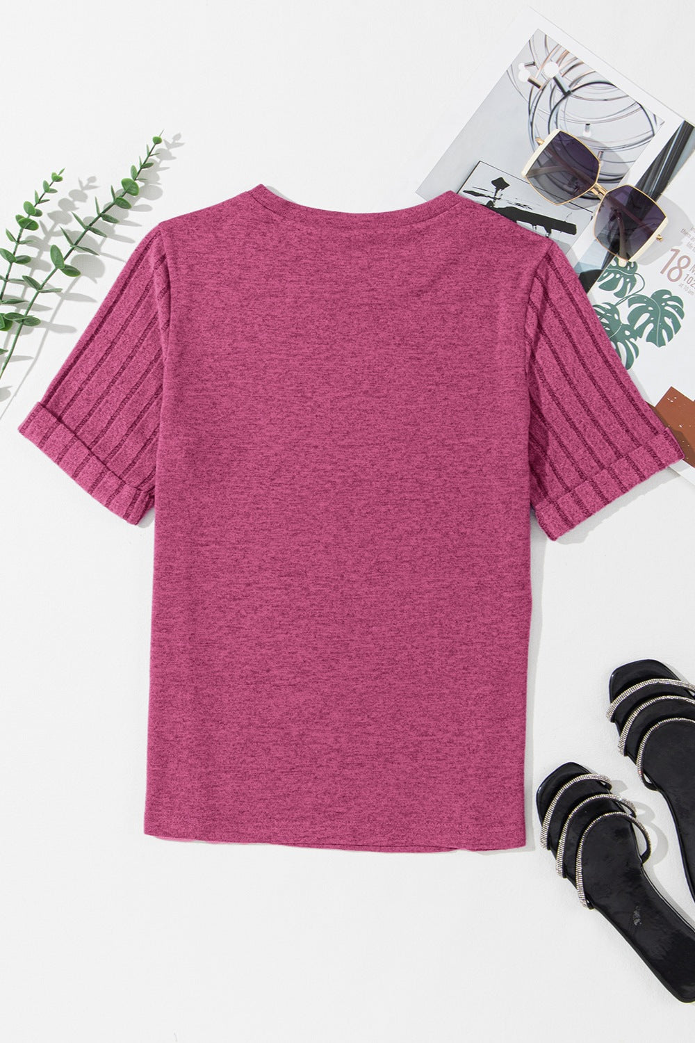 Hot pink t-shirt with ribbed short sleeves and rolled cuffs.