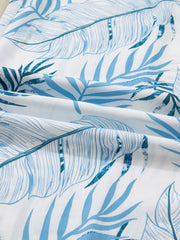 Tropical leaf print wide leg pants in blue and white cotton fabric.
