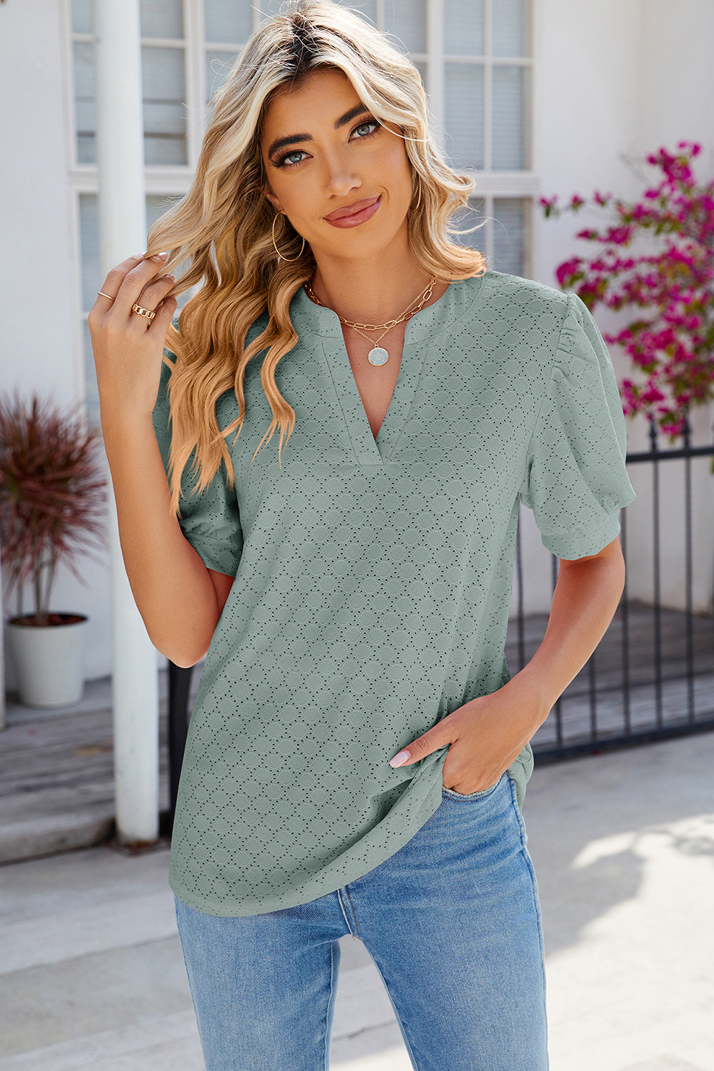 Light Green eyelet V-neck blouse with puff sleeves and diamond pattern.