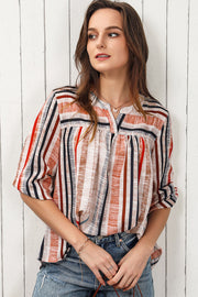 Vertical stripe gathered yoke blouse with V-neck and 3/4 sleeves.