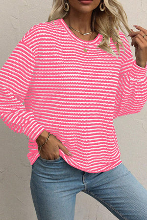 Pink and white striped textured knit top with balloon sleeves.