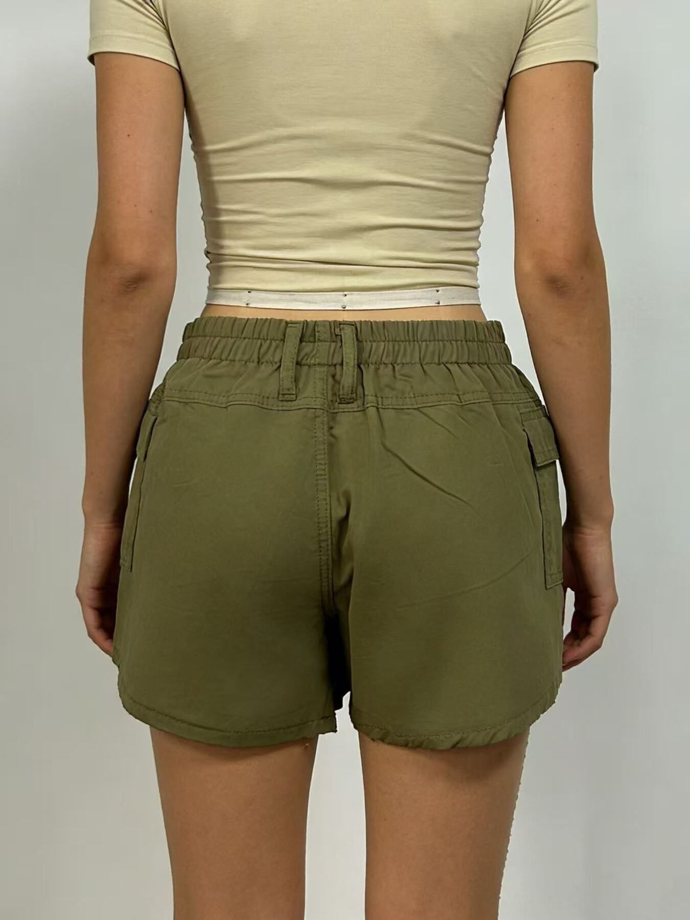 Green cargo shorts with pockets and elastic waistband