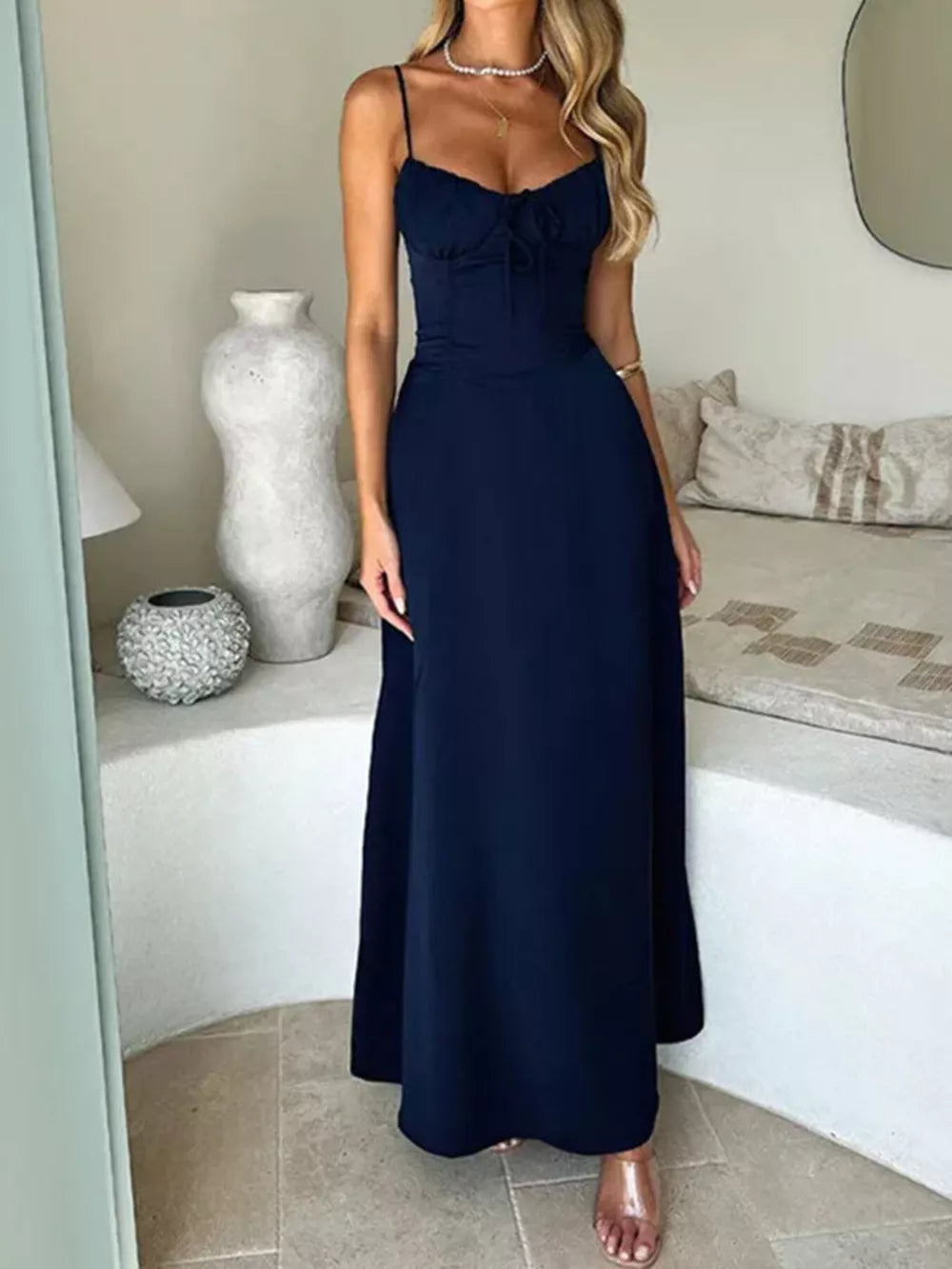 Navy tie-front maxi dress with spaghetti straps and a cinched waist.