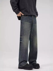 Men's relaxed fit jeans in faded blue denim with a vintage wash.