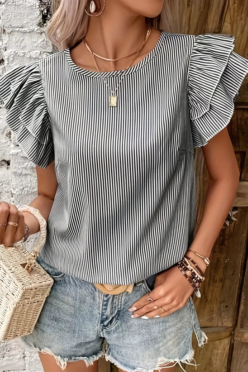 Chic striped polyester shirt with ruffled short sleeves and a crew neck.