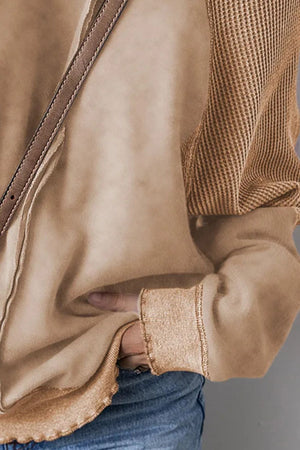 Tan waffle knit raglan sweatshirt with contrast cuff and hem detail.