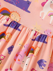 Toddler cotton dress with whimsical unicorn, cat, sun, and rainbow print, featuring a ruffled waist.