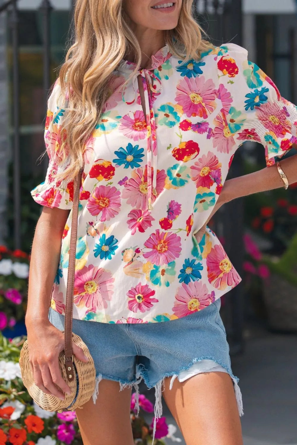 Vibrant floral print cotton blend shirt with ruched sleeves and tie neck