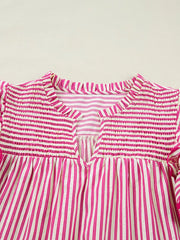 Shirred yoke striped cotton blouse with ruffled neckline and V-split.