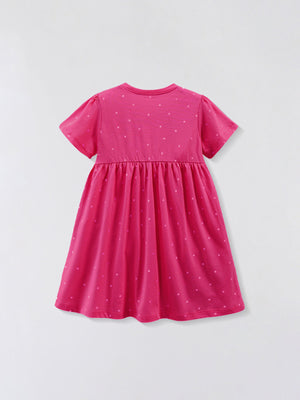 Pink cotton baby dress with scattered polka dots, crew neck, short sleeves, and gathered skirt.