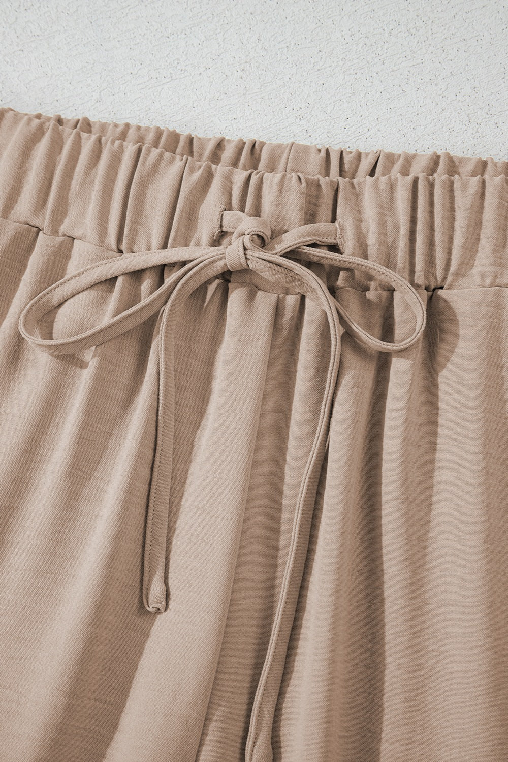Camel drawstring palazzo pants with elastic waistband and tie detail
