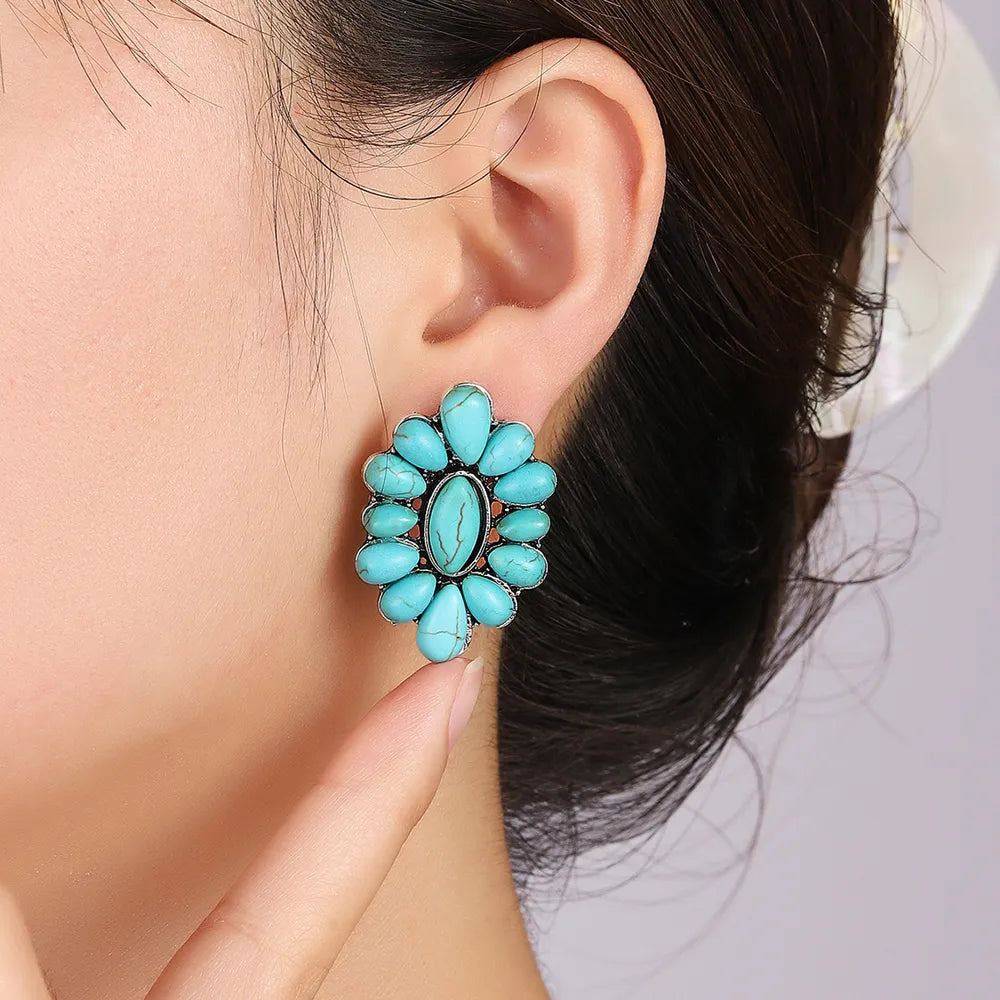 Turquoise petal stud earrings with silver alloy setting.