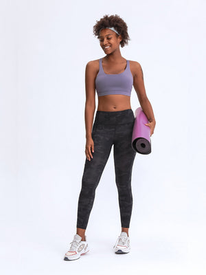Black camouflage sculpt leggings with pockets, full length.