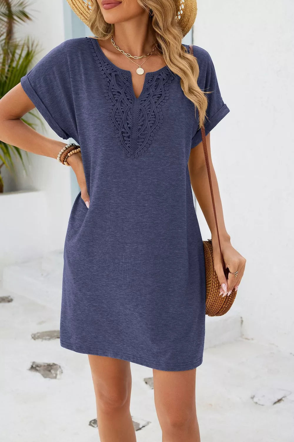Dusty blue V-neck dress with lace detail and short sleeves.