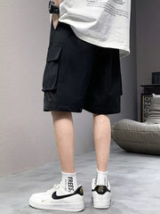 Black relaxed fit cargo shorts with side pockets and drawstring detail.