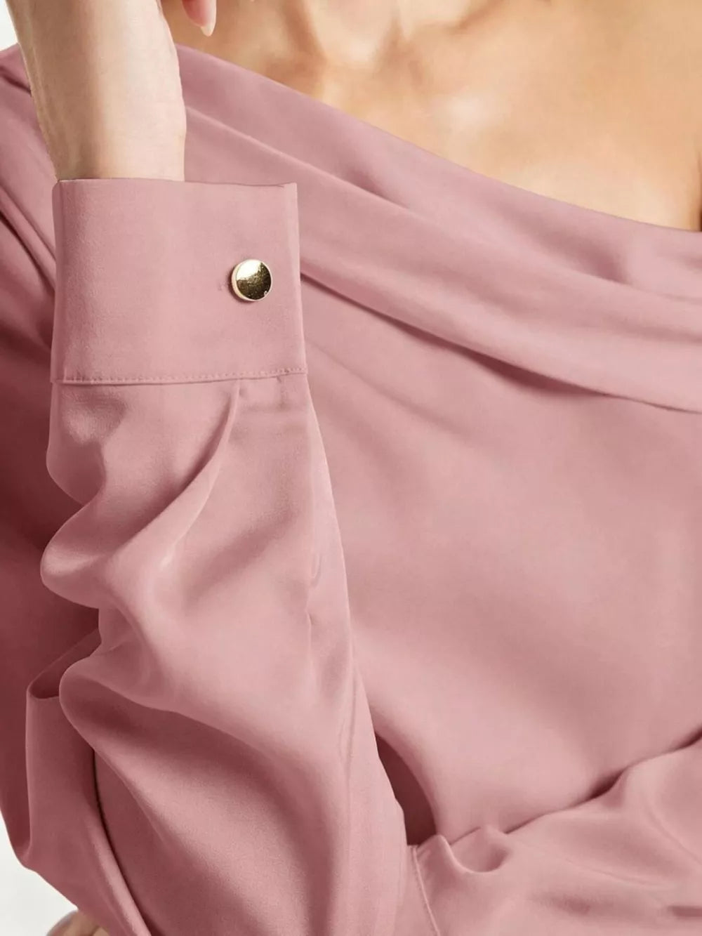 Elegant one-shoulder satin shirt in rose pink with a gold button cuff detail.