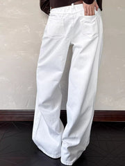 White cotton belted wide leg jeans with back pockets visible.