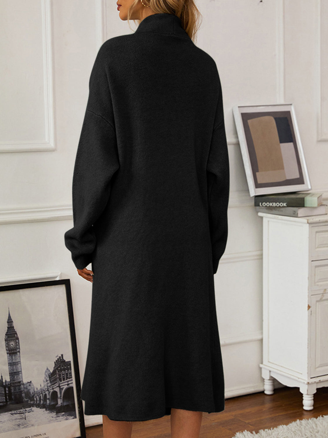 Black ribbed knit midi dress with a high neckline and long sleeves, acrylic material.