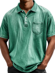 Green acid wash relaxed fit polo shirt with chest pocket and button placket.