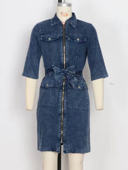 Denim shirt dress with zipper front, tie waist, and short sleeves in blue.