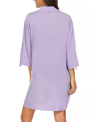 Oversized collared shirt in light purple polyester with rolled tab sleeves.