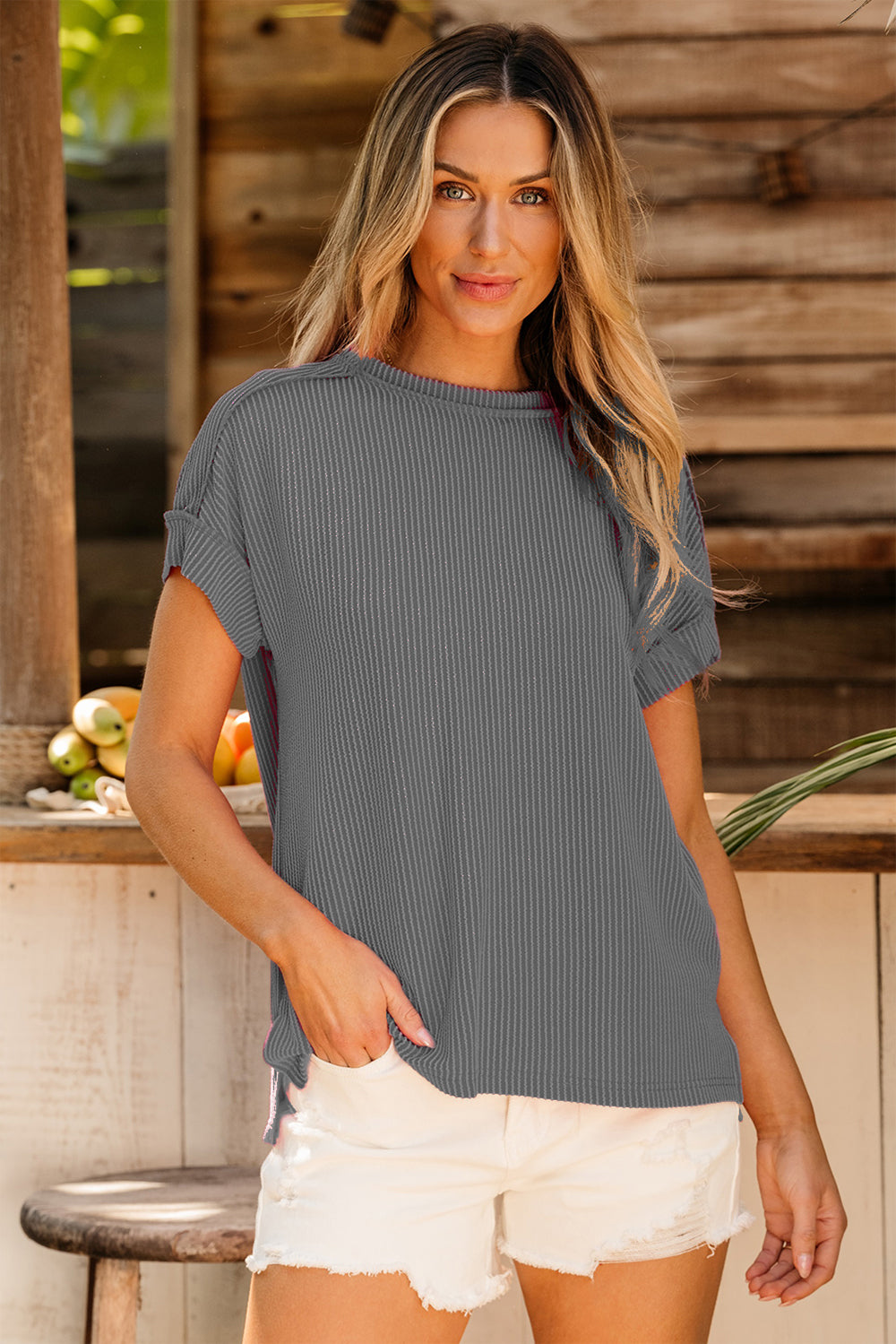Textured ribbed tee in dark gray with rolled sleeves and a relaxed fit.