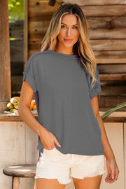 Textured ribbed tee in dark gray with rolled sleeves and a relaxed fit.